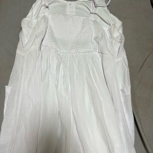 This summer dress by Mlle Gabrielle, has never been worn. It’s very lightweight.